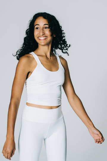 Attain Studios - Longeline Variety Sport Top in off-white with bra insert for yoga or fitness in off-white, made out of recycled material. Size S